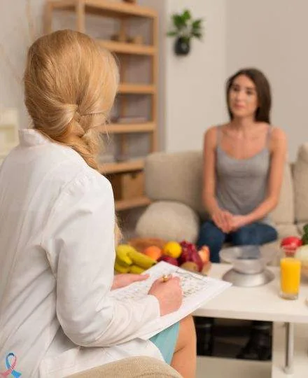 A specialist going through a meal plan with a client.
