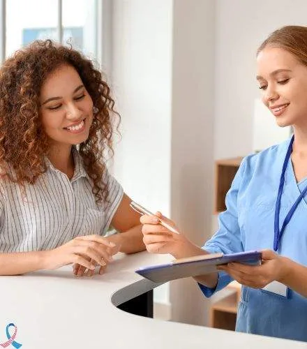 A nurse going through a form with a patient.