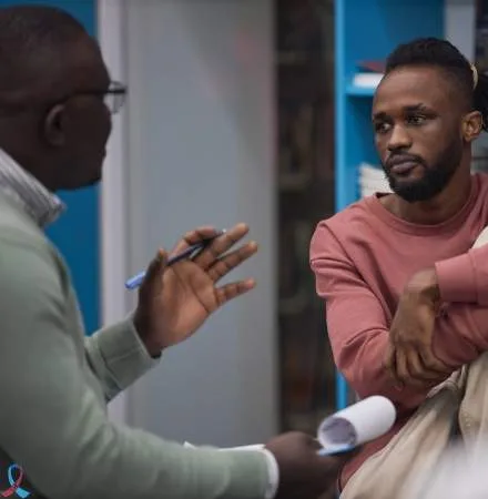 Two men talking through a health check.