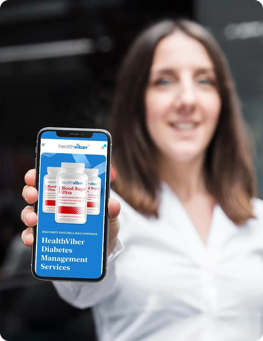 A woman holding up a phone showing HealthViber Diabetes Management Services.