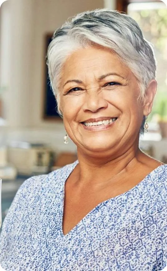 A smiling woman at home.